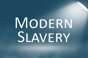 Graphic showing the words 'Modern slavery' under a spotlight