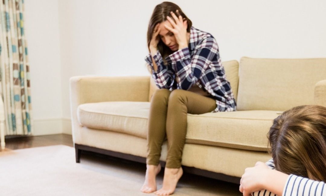 Mother and daughter distressed in living room