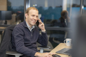WWH staff member smiling whilst talking on a mobile phone